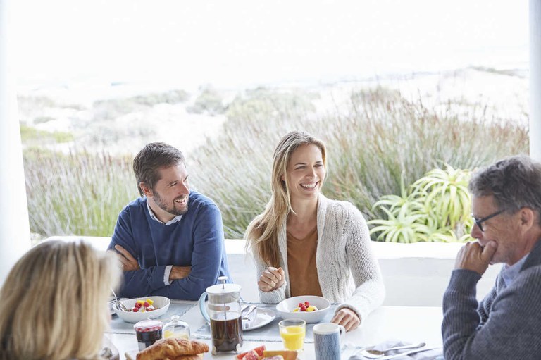 couples-enjoying-breakfast-on-beach-patio-HOXF02263.jpg